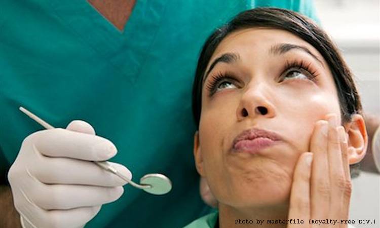 Woman glues teeth in her mouth